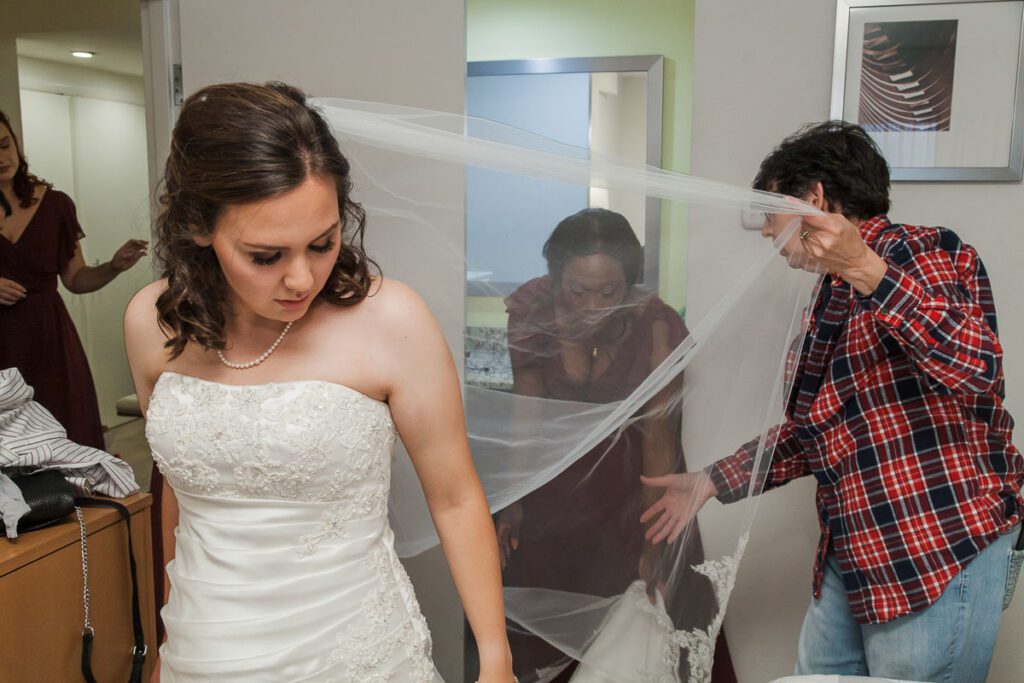 Rachel wearing her wedding dress and veil