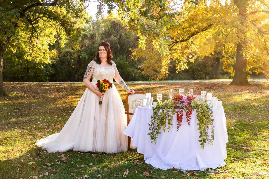 A bride holding a chair and her flowers