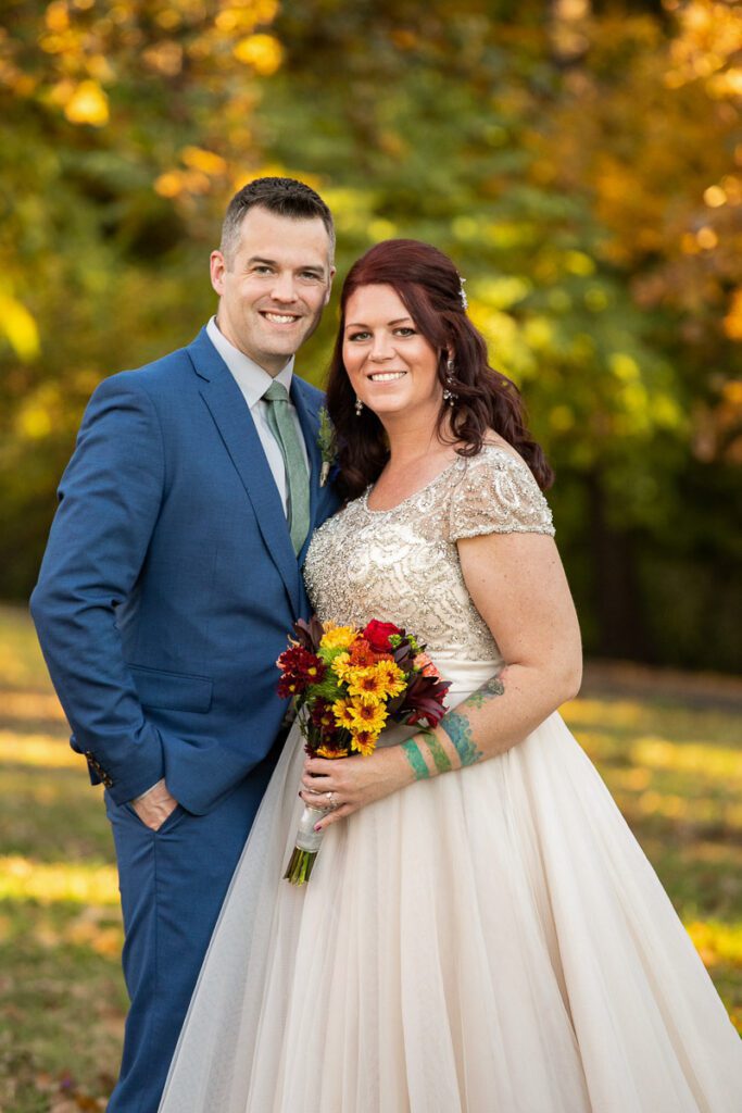 A groom and bride in a portrait image