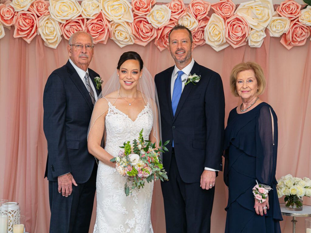 A bride with the groom and his parents