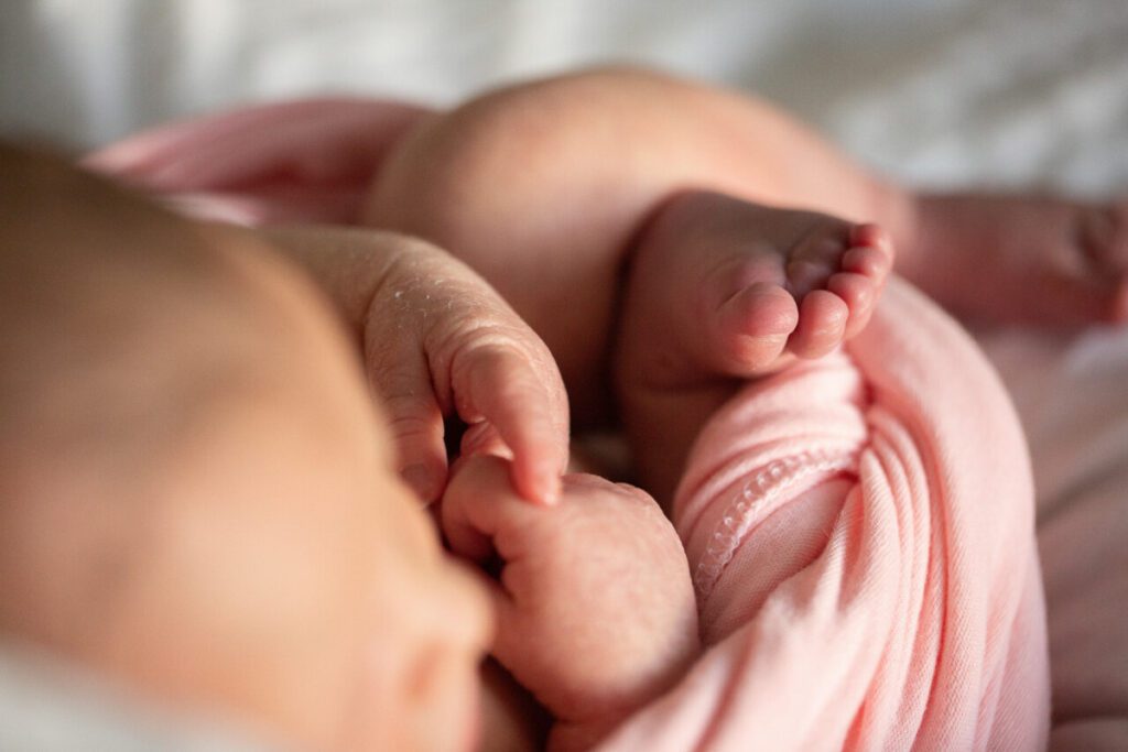A baby’s hands and feet