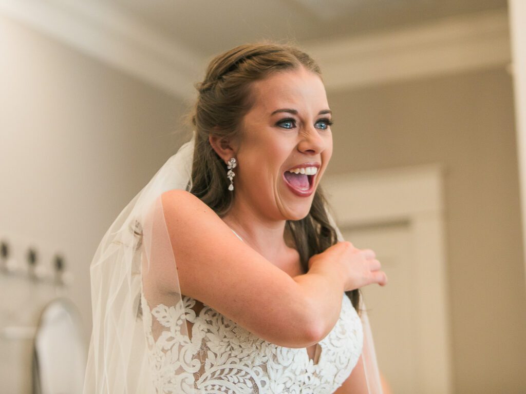 Bride is laughing and her eyes filled with tears