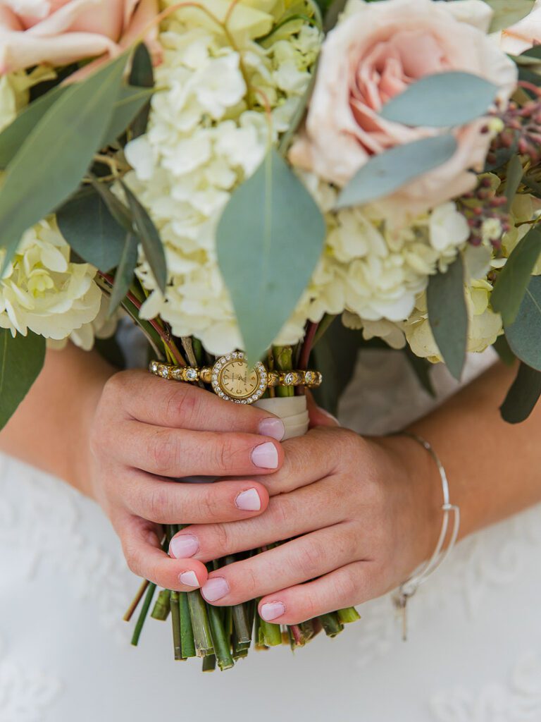 A close shot of holding bouquet