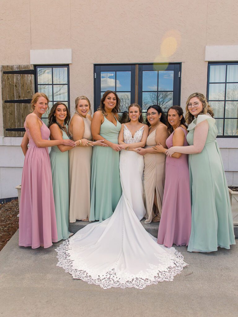 Bride and Bridesmaid holding each others hand
