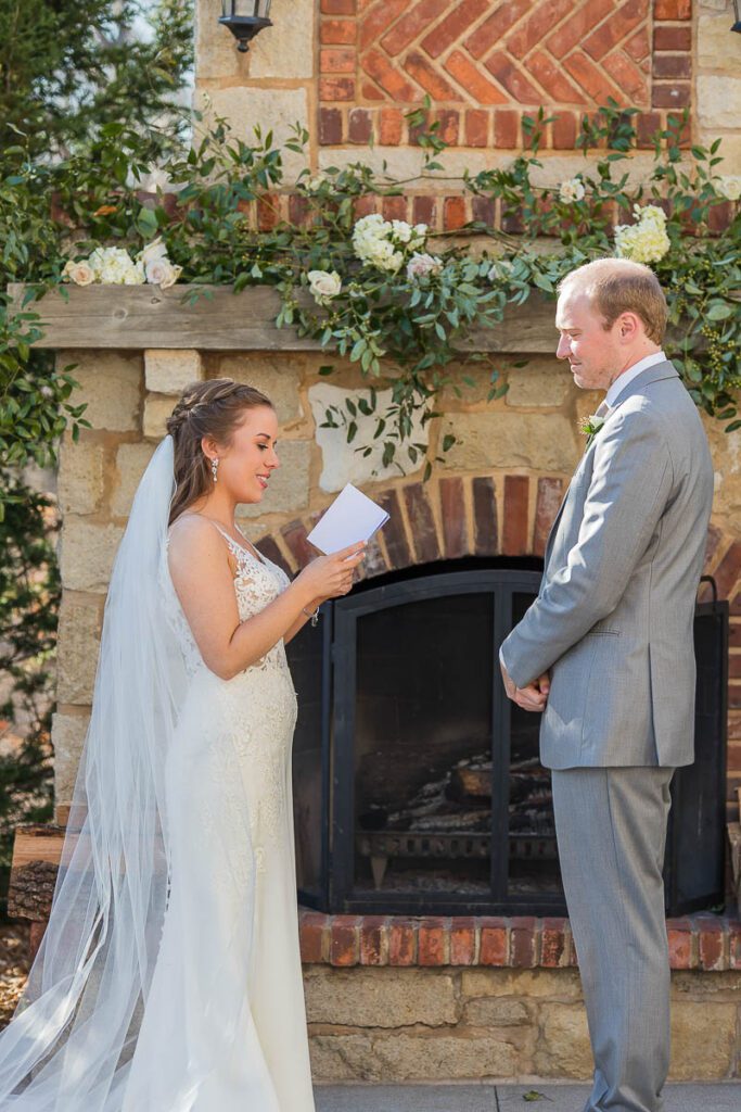 Bride reading a note to groom