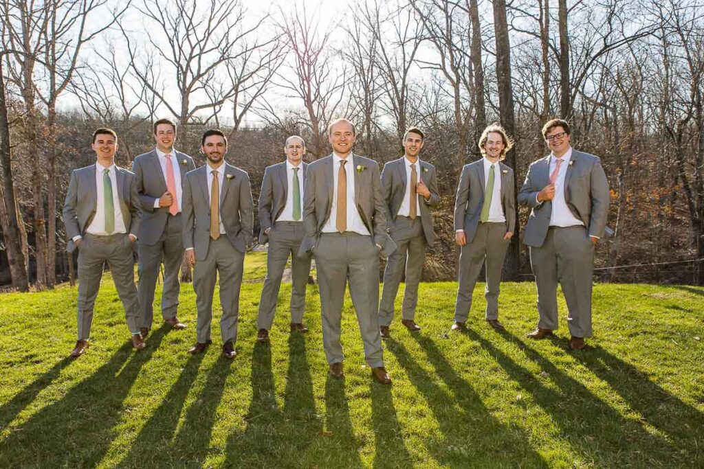 All Grooms men posing with groom