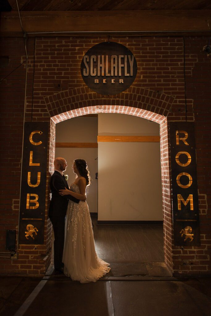 Bride and Groom posing at the Schlafly beer