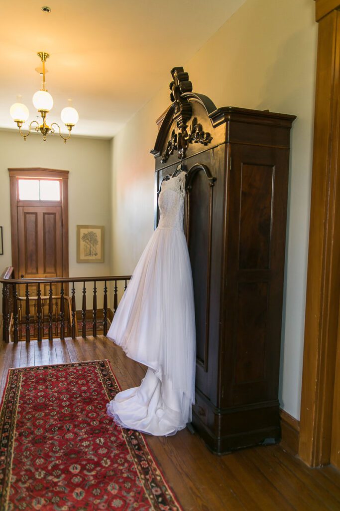Wedding dress hanged on cupboard