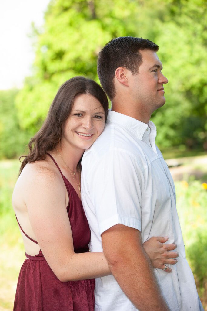 Wife holding husband from behind