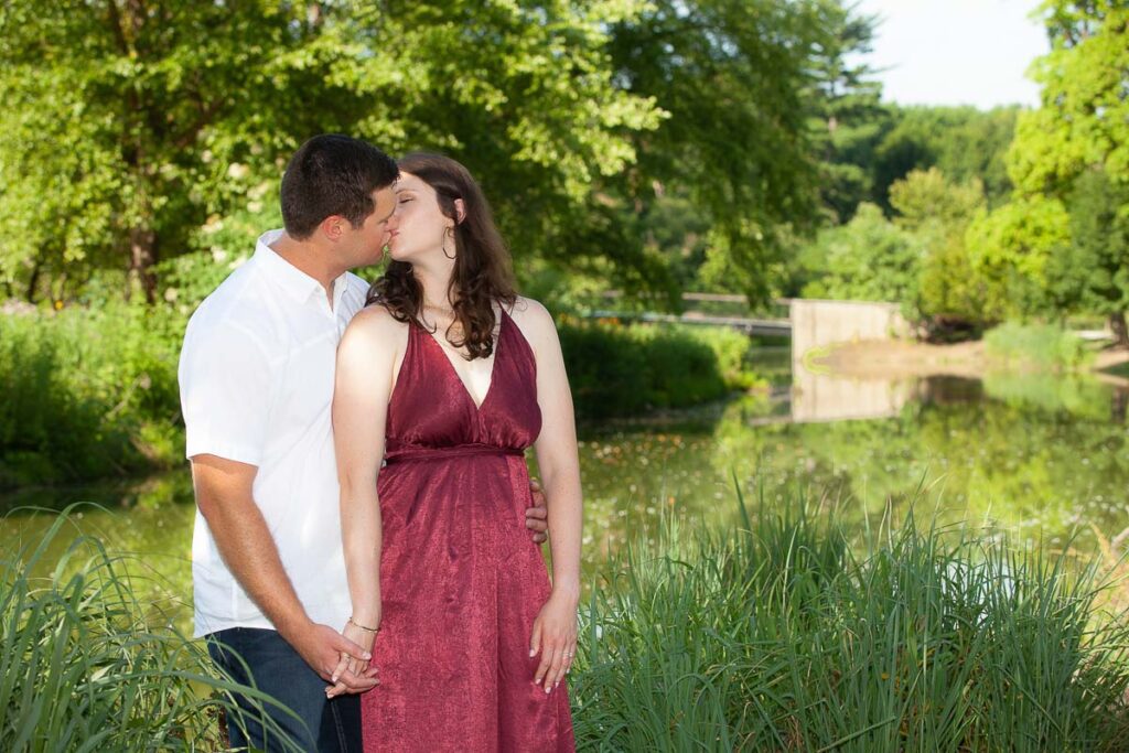 Couple kissing each other near the pond